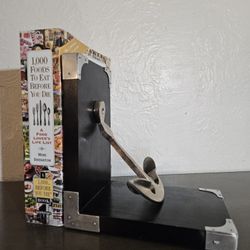 Nautical Bookend With A Black Base And A Silver Anchor