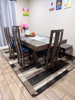 solid Sheesham wood dining table with 4 chairs and 1 bench.