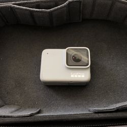 Gray GoPro Hero 7 White with lots of attachments