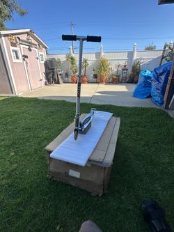 Razor scooter chrome with rear brake  similar new  only used a couple of times