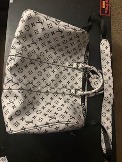Grey and black duffel bag