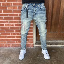 Amiri Rose Gold Staggered Logo Denim Jeans