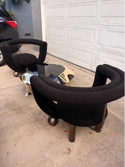 Black coffee table and accent chairs