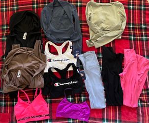 A bundle of  different brand gym clothes