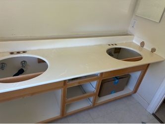 Free double oval sink solid acrylic counter top and two matching Kohler sinks