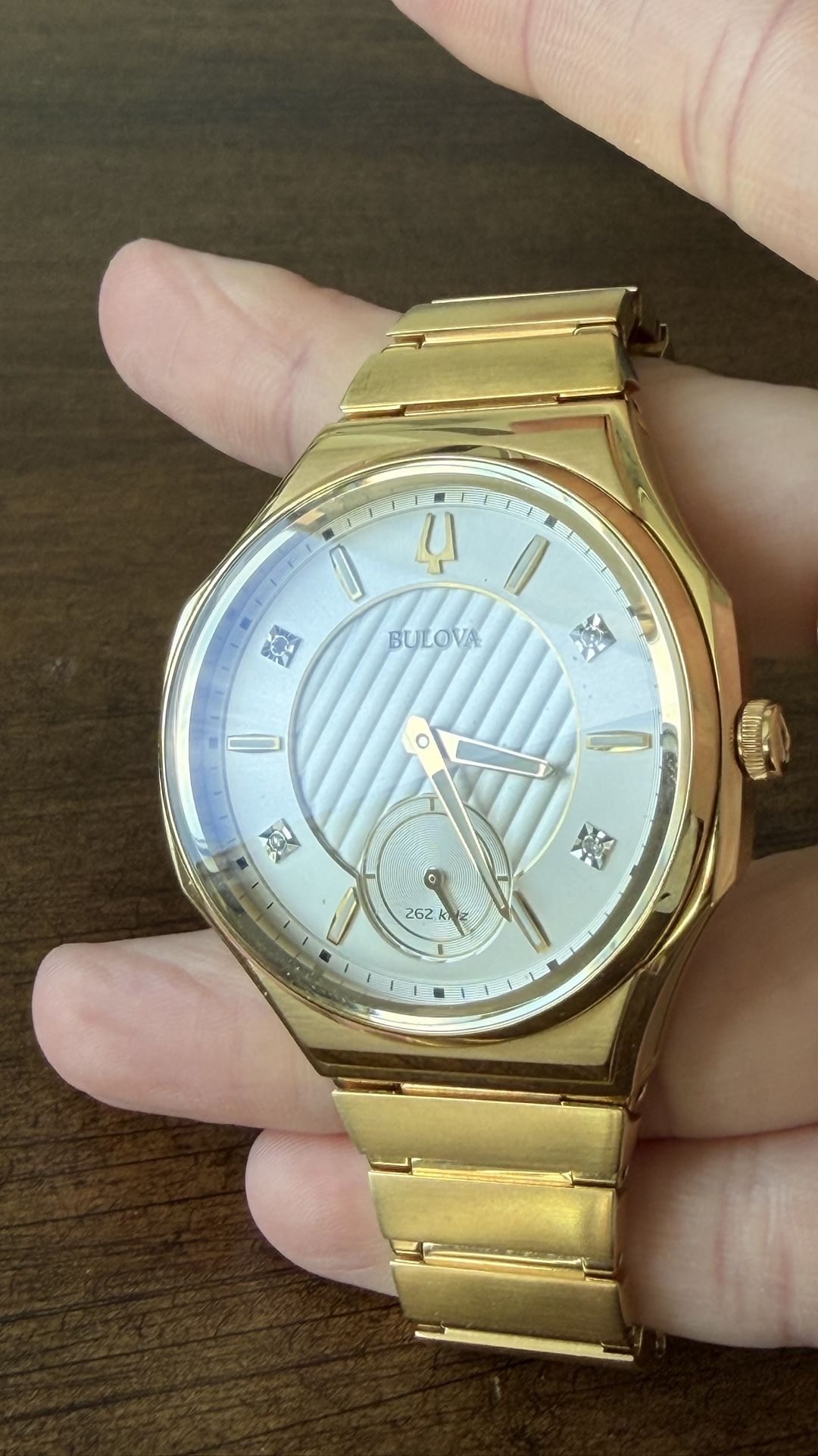 The Bulova Curv Gold PVD Steel Diamond Silver Dial Watch
