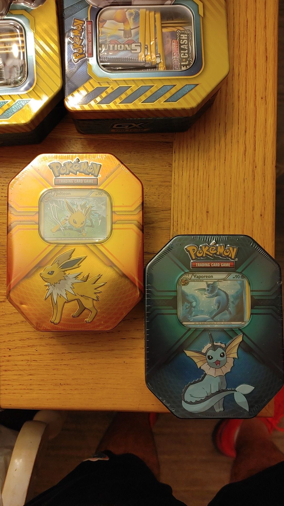 Two collector tins, 6 packs