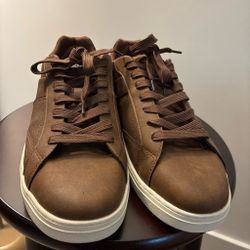 Brown leather sneakers.