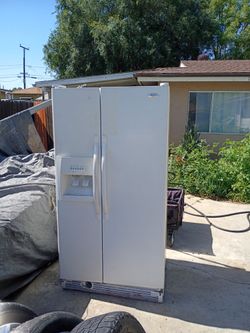 Refrigerator runs great call (contact info removed)