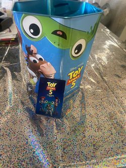 Toy Story 5 tin with one ticket