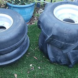 ATV classic sand tire duo with front ribs and rear paddles.
