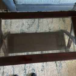 Wooden coffee table with glass top