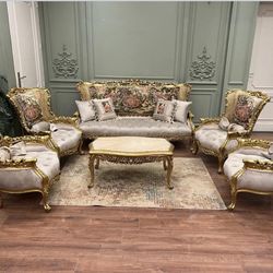  Reproduction Sofa Set LOOK UP A modern reproduction Italian-style carved wood and upholstered sofa set. TIME PERIOD Contemporary ORIGIN Italy (Reprod