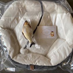 Gapzer pet bed and a cat toy shaped like a fish.