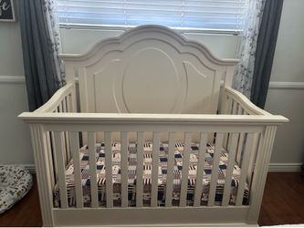 White sleigh bed crib