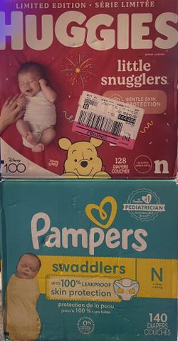 two Boxes Of Newborn Diapers 