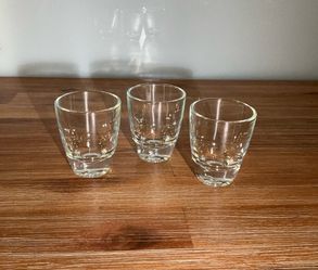 Clear glass shot glasses with a heavy base,