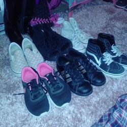 Two Pairs Of Vans Two Pairs Of Converse Pair Of Adidas In A Pair Of Nikes And Two Pairs Of Boots All Different Sizes For Kids