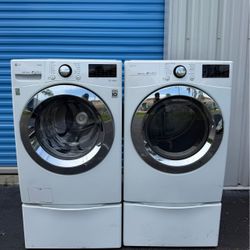 LG front-loading washer and dryer with pedestals