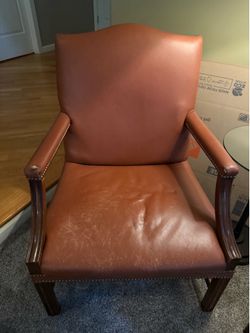 2 vintage leather arm chairs