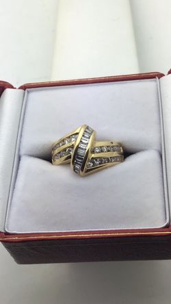 18k Yellow Gold Ring Channel Set Overpass Design Set a with Round and Natural Baguette Diamonds  Approximately 1 Carat total weight
