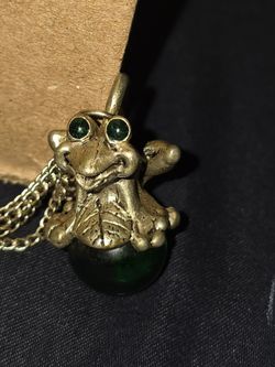 Pewter Frog on green orb with chains and bells