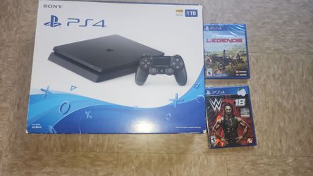 NIB NEVER USED PS4 1TB  WITH 2 SEALED GAMES INCLUDED