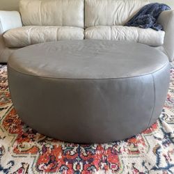 Room & Board 42” grey leather ottoman. 