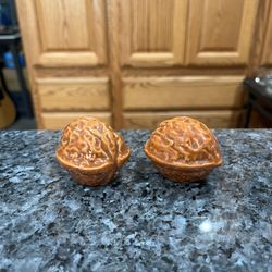 Vintage 1950’s Ceramic Walnut Shaped Pair Of  Salt and Pepper Shakers.  Preowned The Bottom Has Masking Tape