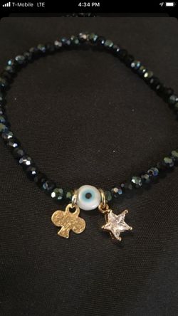 Elastic bracelet with gold plated charms !