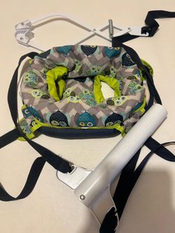 Evenflo baby doorway jumper with owl design in gray and green, 24 lb (11 kg) maximum.