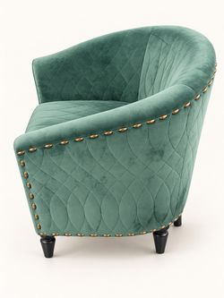 Teal quilted accent chair.