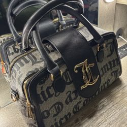 Juicy Couture black and grey purse with gold detailing.
