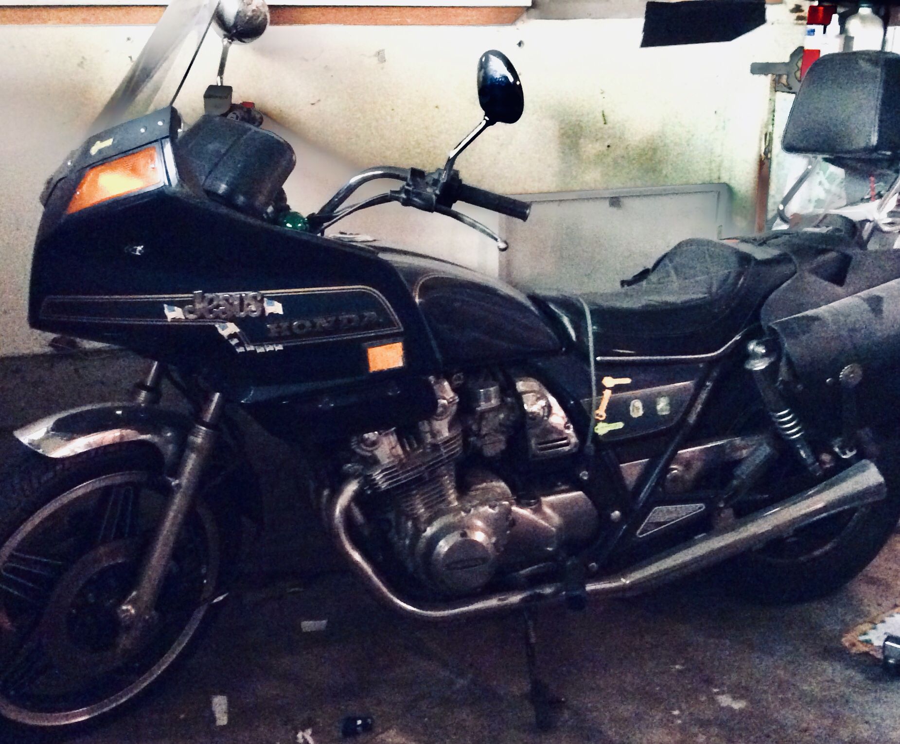 Honda 1981 CB 750 Custom Motorcycle. It has low mileage 20,877. Survivor bike needs tender loving care will include black saddle bags with 2 helmets