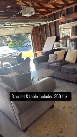 Three-piece couches good condition and table