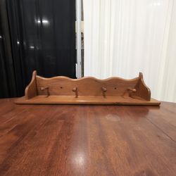 Warm Wood Scalloped Wall Shelf with Peg Hooks