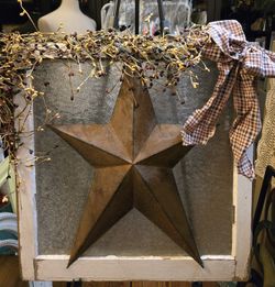 Farmhouse glazed window with metal star dried flowers