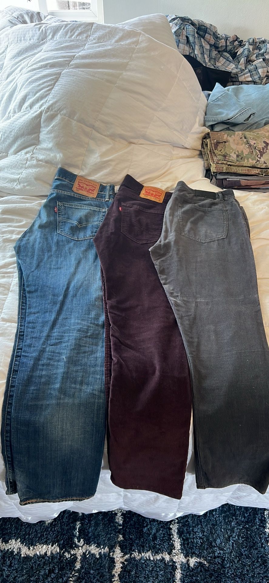 Two pairs of Levi’s one pair of Michael Kors