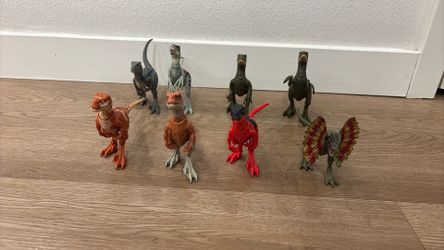 4 velociraptors 3 Atrociraptors 1 Dilophosaurus