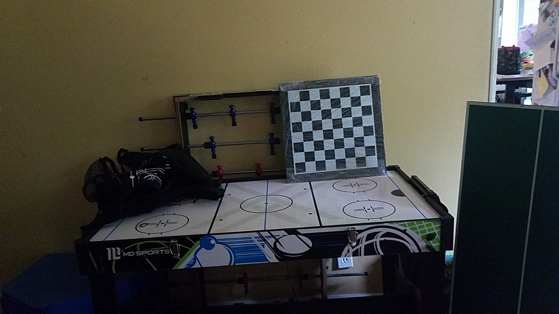 Electronic air hockey, foosball, pingpong, and basketball table.