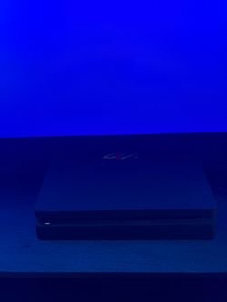 PlayStation 4 with 2 controllers and a headset