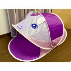 Purple kids play pop up tent with unicorn face. Folds up, indoor or outdoor play.