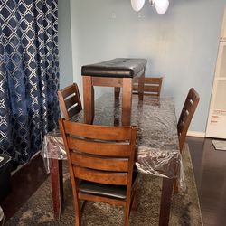 Dinning table with a bench