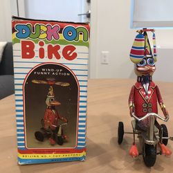 Vintage Wind Up Toy Duck On Bike