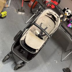 Black and Beige Baby Stroller with Wheels