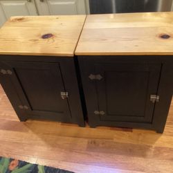2 Black pine cabinets / end tables / night stands each has a door opens to storage and a shelf ,sides are slatted as in picture ,real clean ,just perf