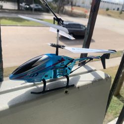mini remote-control (RC) toy helicopter in blue and black.