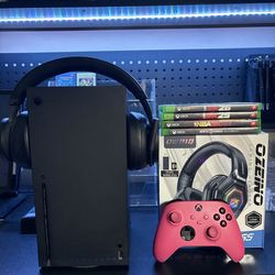 Xbox one with 4 games 2 headsets and a controller