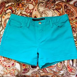 $7     CALVIN KLEIN TURQUOISE SHORTS      SIZE 6