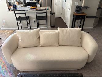 Cream sheep couch